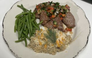 Chimichuri on beef with green beans and mashed potatoes.